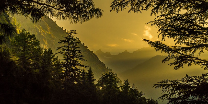 A golden hour shot of mountains in Kasol