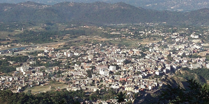 An aerial view of Katra amidst the mountainous terrain near Vaishno Devi Temple.