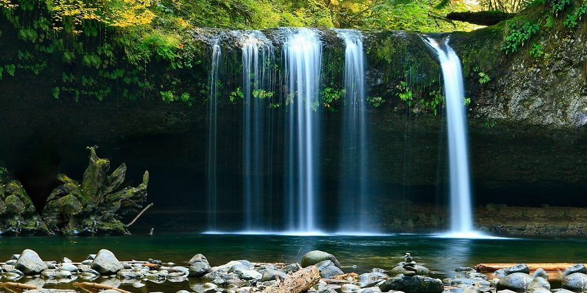 Image of a peaceful waterfall - long-exposure photo of lake with waterfall at daytime