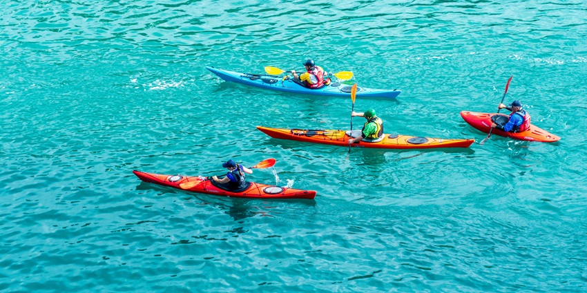Scenic view of boats kayaking through North Button Island National Park