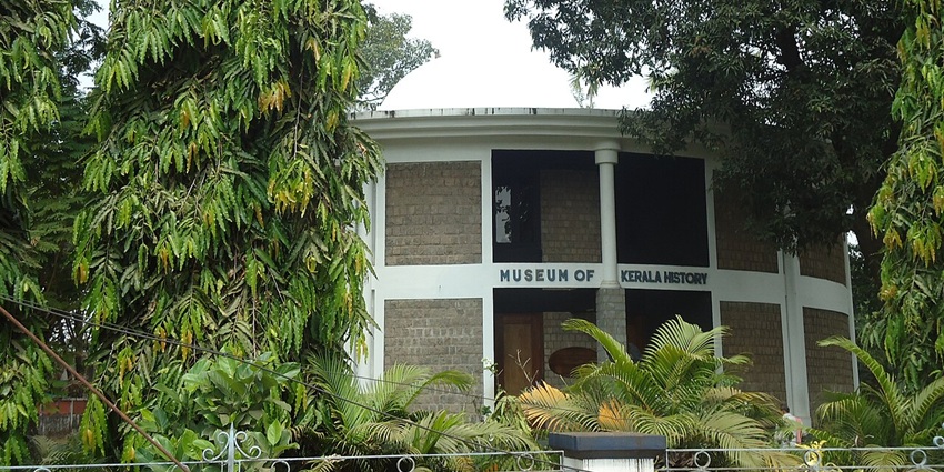 Circular domed Museum of Kerala History at Edappally nestled amidst lush greenery and trees