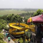 People enjoying slides in a water park