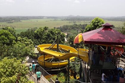 People enjoying slides in a water park