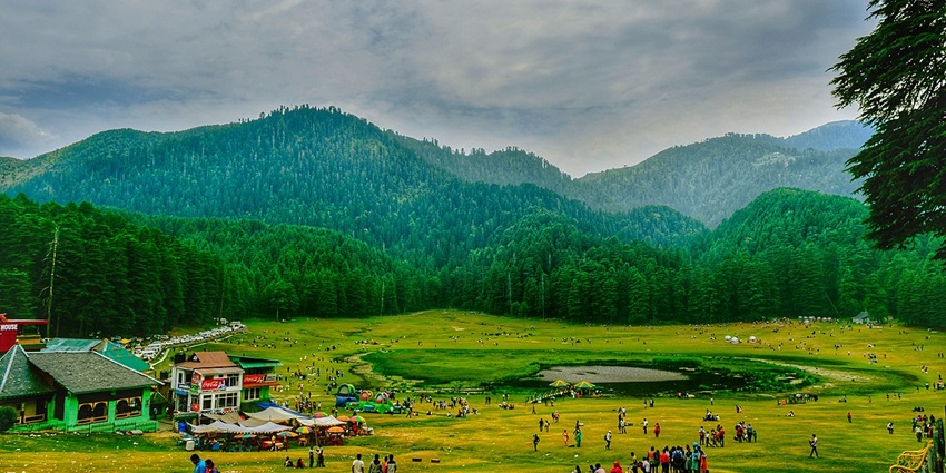 Khajjiar lake surrounded by green valleys - places to visit in india in june with family