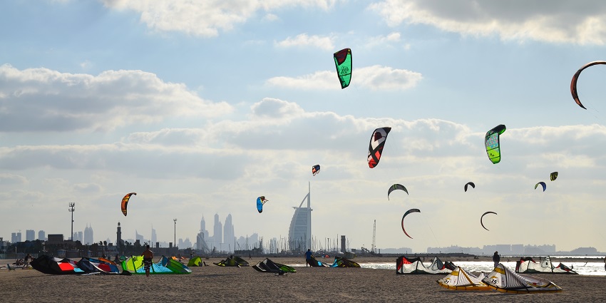 Vibrant kites flying in the sky of Kite sky, one of the favourite beaches in Dubai