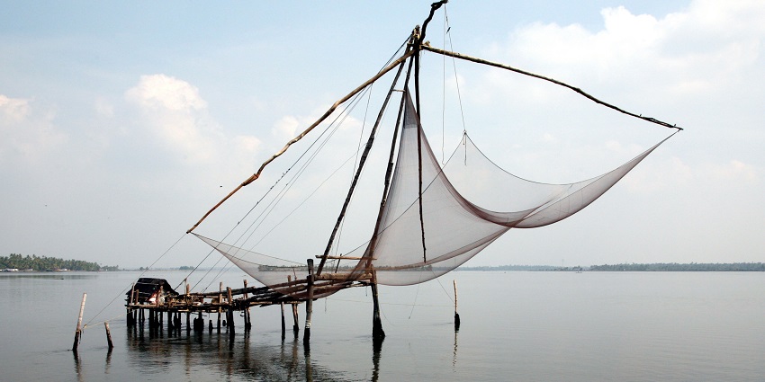 Chinese fishing nets hanging over the Arabian Sea - Places to visit in South Kerala