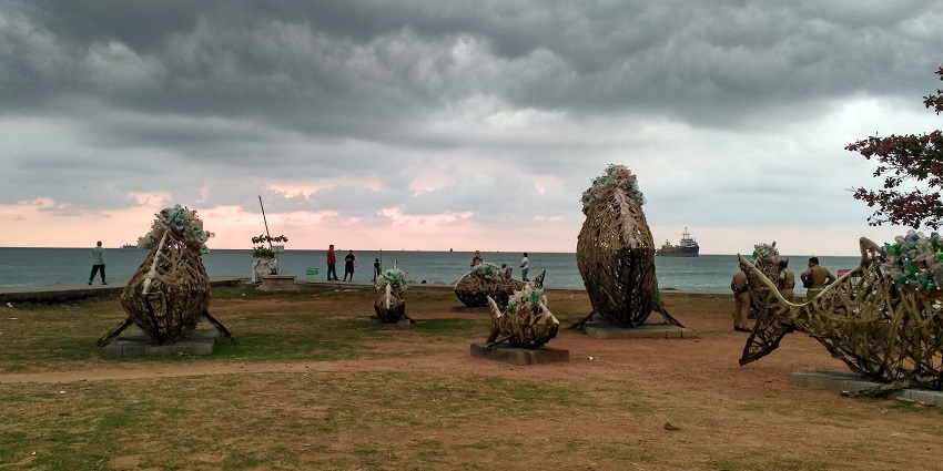Artists displaying their artwork for the Kochi-Muziris Biennale at Fort Kochi Beach.