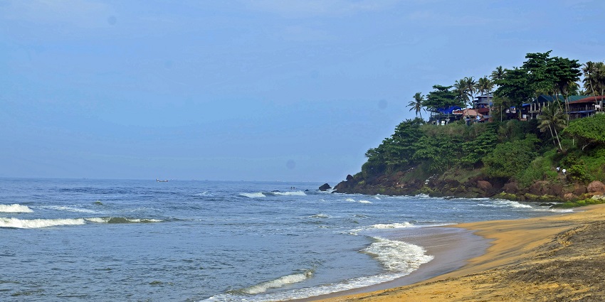 Enjoy the serene waters and sandy coasts of Kollam Beach, near Jatayu Nature Park, India.