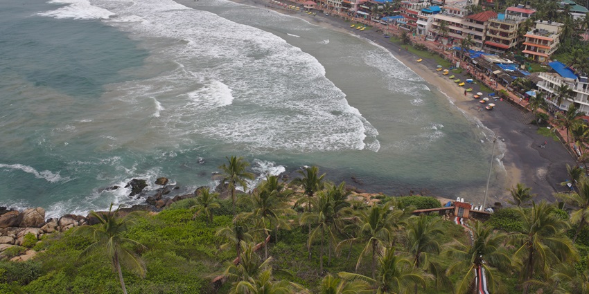 Sandy shores of the Kovalam beach adds to the remarkable coastal beauty of Kerala