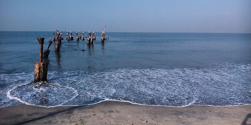 Enjoy the serene waters of Kozhikode beach, which is one of the things to do in Kozhikode.