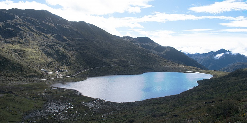 A mesmerising landscape of the Kupup Lake in East Sikkim surrounded by majestic mountains.
