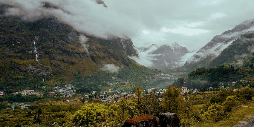 View of a valley with mountains in the background - places to visit in north east India