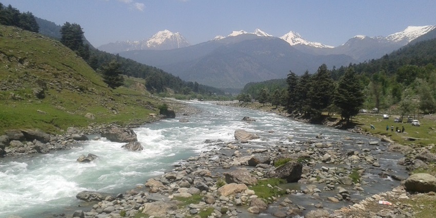 A view of the Lidder Valley featuring the glistening Lidder River and lush greenery.