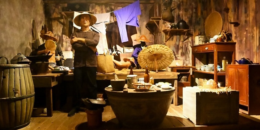 The display of Chinese Coolie room display at Madame Tussauds, Sentosa Island attraction.