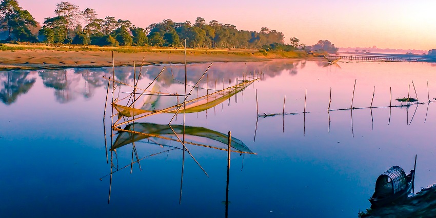 Majuli, the largest river island in Assam, with its lush landscapes and vibrant culture.