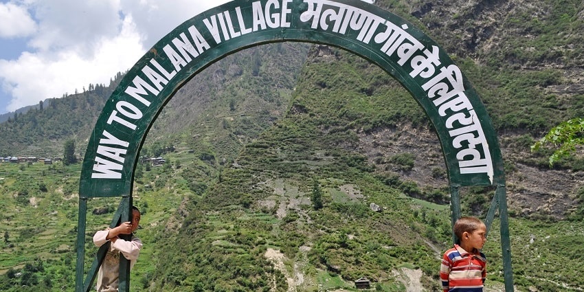 A direction board at the entrance of Malana