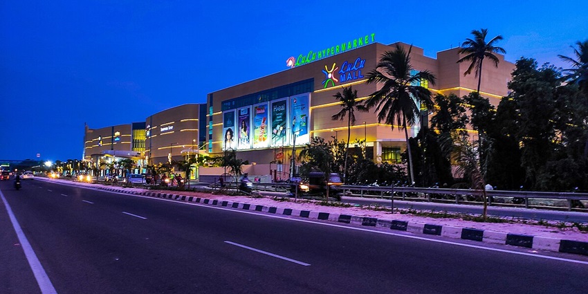 Clear view of Lulu Mall on the side of the road in Thiruvananthapuram city