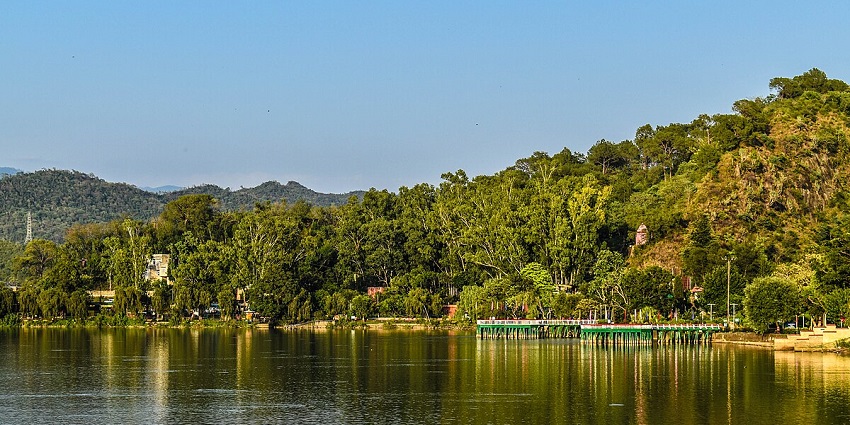 Mansar Lake offers stunning views of lush greenery amidst the surrounding high mountains.