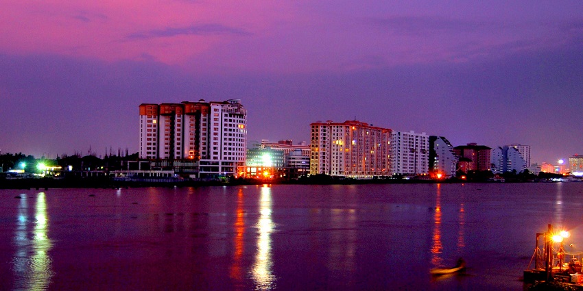 Vibrant skyline reflecting in the waters of Marine drive of Kochi offering a photogenic view