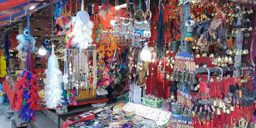 A vibrant look of a market in Mcleod Ganj with colourful items such as dreamcatchers.