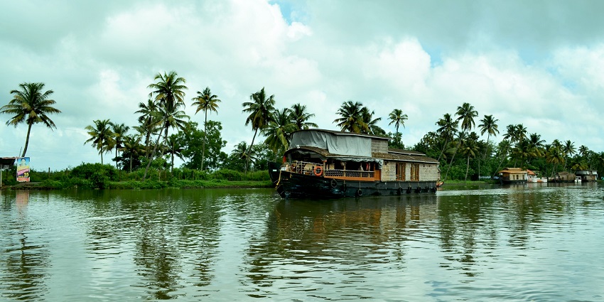 Take a cosy boat ride on the backwaters one of the best places to visit in Mattancherry