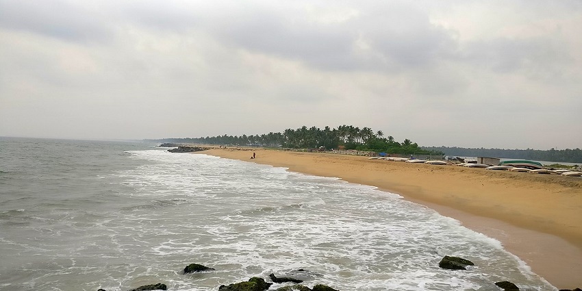 Sandy Beach view of the ocean at the Thanni beach of Beautiful Mayyanad under sunny sky