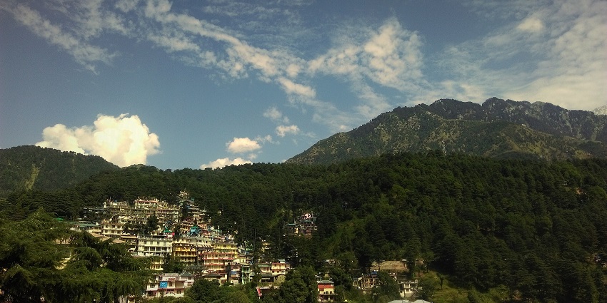 An image with the view of McLeodganj from top of the hill, surrounded by lush greenery