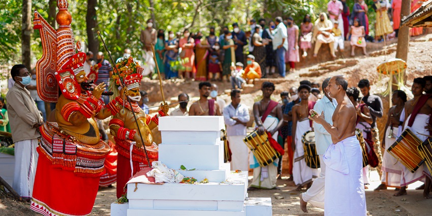 A devotee in deep meditation in front of the deity at the famous Temple, Kerala India.