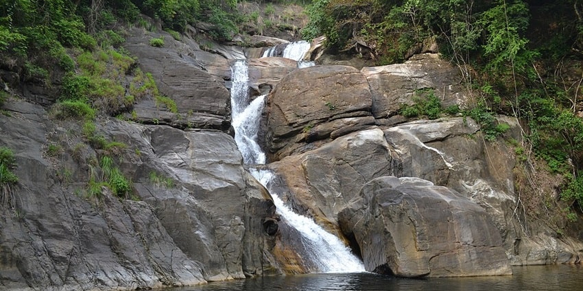 Witness the mesmerising Meenmuty waterfall, Thiruvananthapuram, near Edakkal caves.