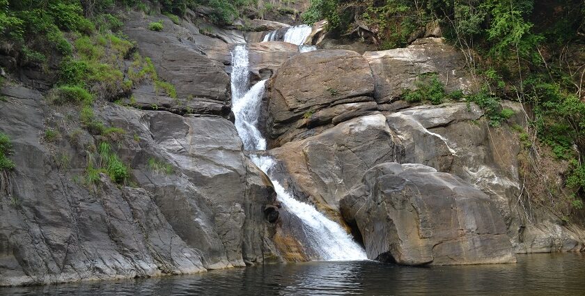 Experience the beautiful Meenmutty Waterfalls located in serene Wayanad, Kerala, India.