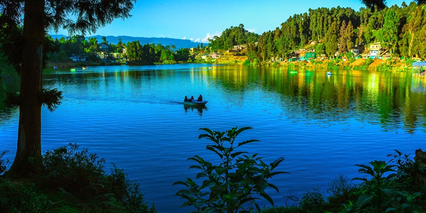 Serene view of Mirik Lake surrounded by lush greenery - places to visit near Siliguri