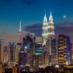 Moonrise over Kuala Lumpur, illuminating the skyline - places to visit in Kuala Lumpur.