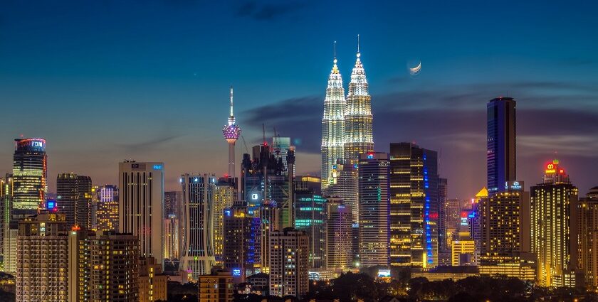 Moonrise over Kuala Lumpur, illuminating the skyline - places to visit in Kuala Lumpur.