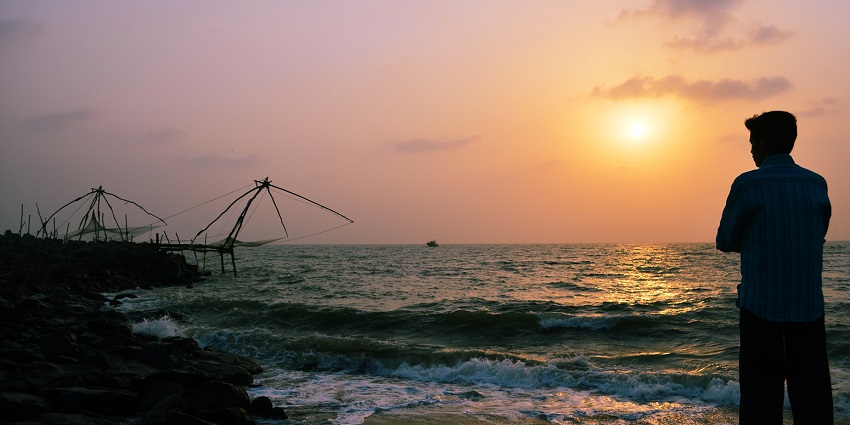 Sunset hues creating silhouettes at Munakkal beach- the largest beach in Thrissur