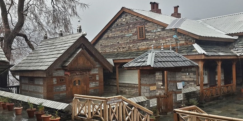 A mesmerising view of an ancient castle made with rocks and wood on a rainy day.