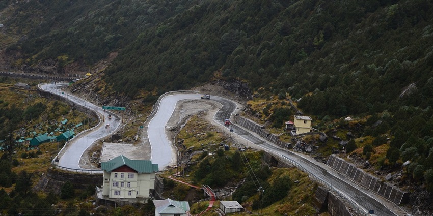 Aerial view of a curvy road on a mountain