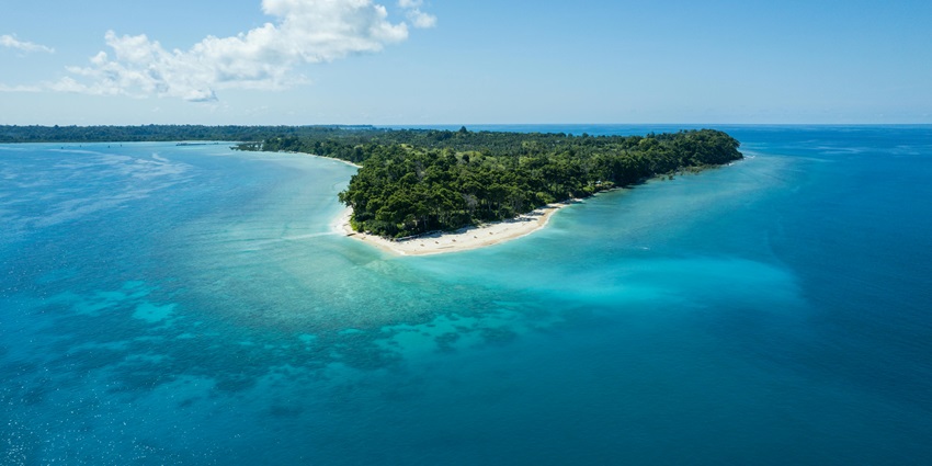 A drone shot of Neil Island with its azure blue waters that are ideal for snorkelling in Port Blair