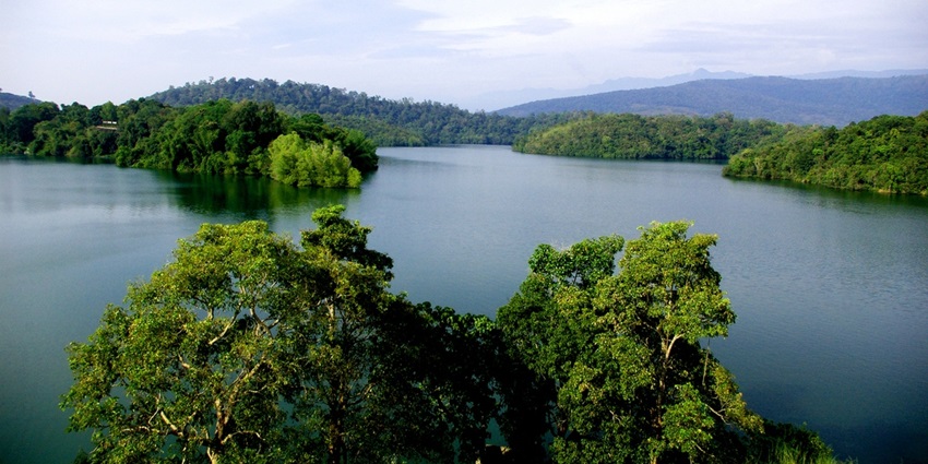 Picturesque lakeside view of the Neyyar dam in the midst of lush dense forests