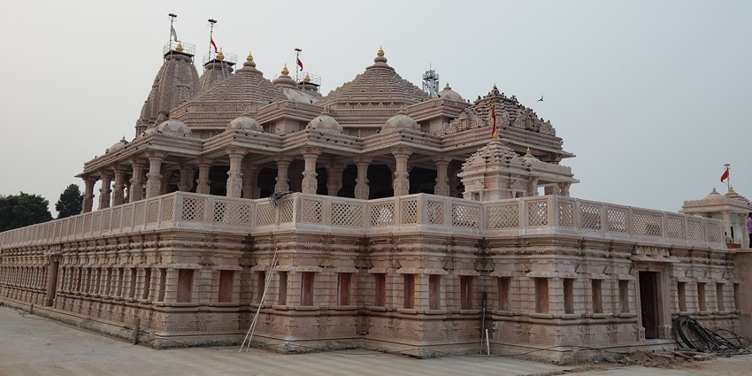 A picture of a historical temple with traditional architecture and intricate wall carvings