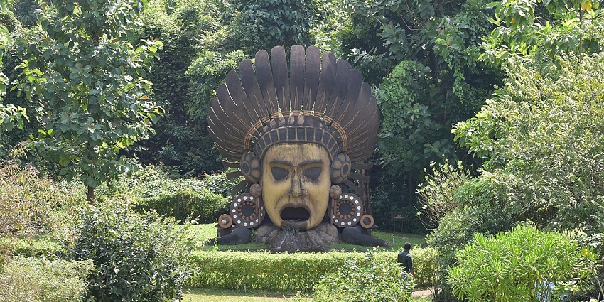 A tribal statue at the Nilambur teak museum, one of the places near Vattayi Waterfalls