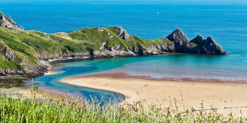 The view of North Bay Beach, featuring turquoise waters and a pristine shoreline.