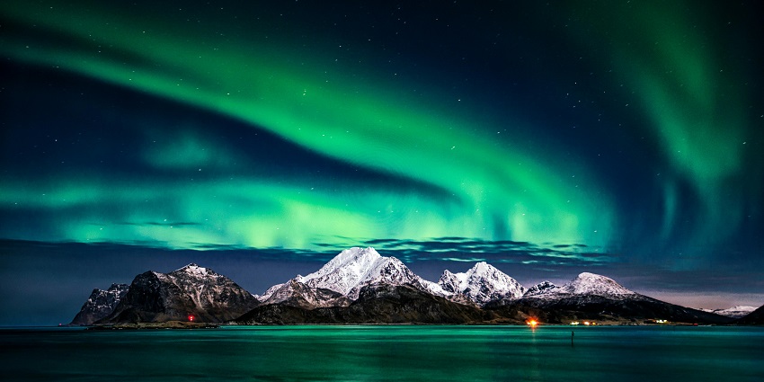 A breathtaking view of the Aurora lights gleaming in the beautiful night sky in Norway