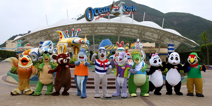 Mascots standing at the entrance of a water park
