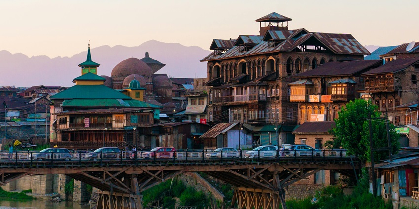 View of Old Zaina Kadal Bridge with the backdrop of historical buildings in Srinagar