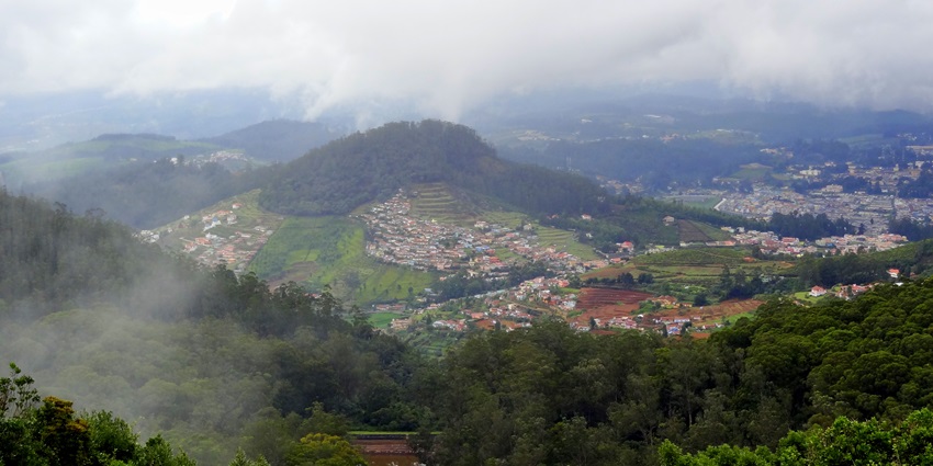 A picture of the beautiful mountains of Ooty with views of the township around the hills