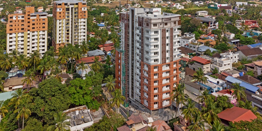 An aerial picture of the cityscape of Palakkad, capturing tall buildings and greenery