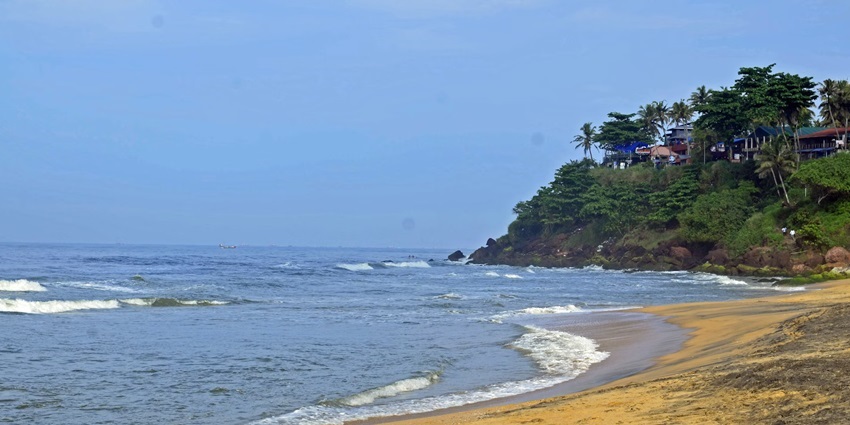 A stunning view of a beach in Kerala, which is a must-visit tourist destination.