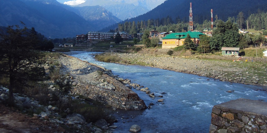 River stream flowing through Pahalgam’s town amidst mountains and valleys in Kashmir.