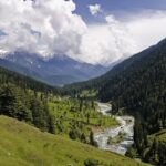 An long shot of the Pahalgam Valley in Kashmir on a bright sunny day.