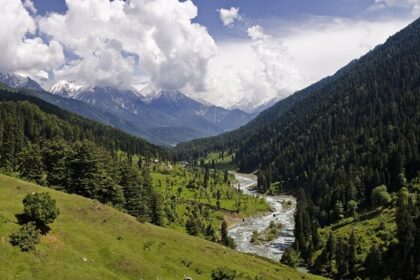 An long shot of the Pahalgam Valley in Kashmir on a bright sunny day.